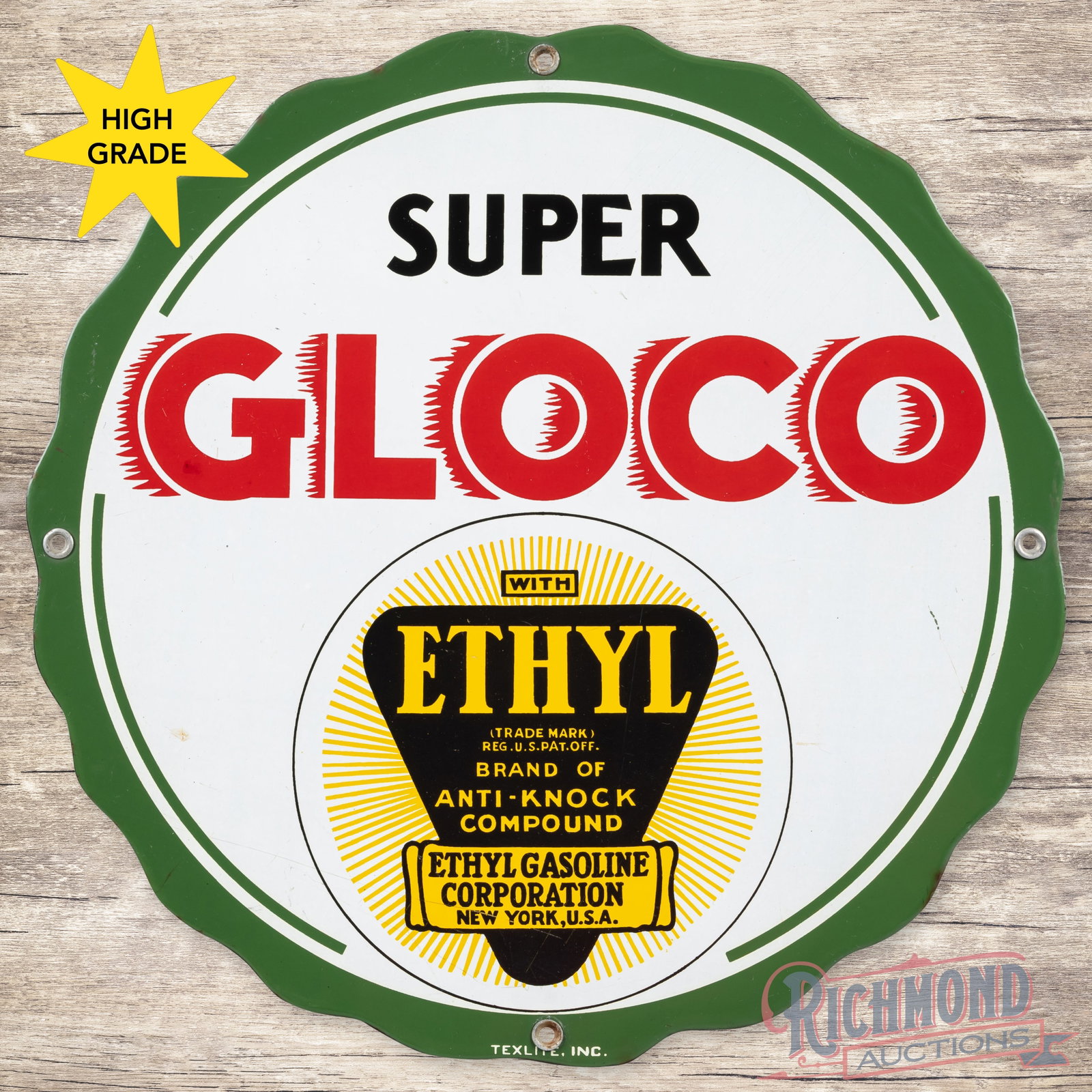Gloco Super Ethyl Gasoline Single Sided Porcelain Pump Plate Sign: SSP (single sided porcelain) sign has very good color and gloss. The display has light wear with a scratch in the right outer field and small area of discoloration in the left outer field. The perimet