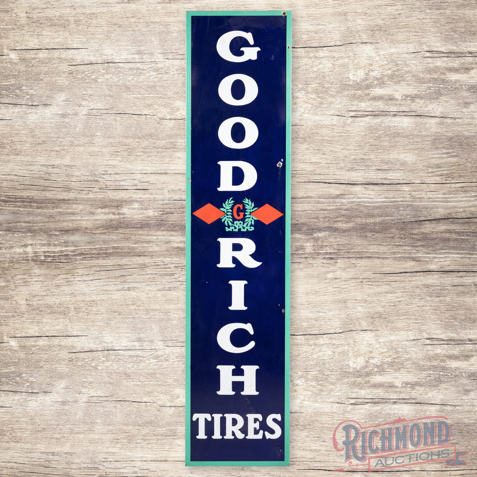 Goodrich Tires 6.5' Vertical Single Sided Porcelain Sign w/ Logo: SSP (single sided porcelain) rolled edge sign has excellent color and gloss. The field has light surface wear with small chips in the outer fields. The perimeter has two small non-factory holes on the