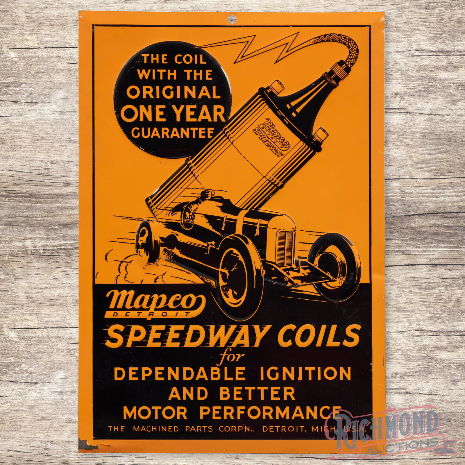 Mapco Speedway Coils Emb. Single Sided Tin Sign w/ Early Race Car: SST (single sided tin) embossed sign has excellent color and shine. The field is very clean overall with minor surface imperfections. The perimeter has light wear with an area of active paint chips on