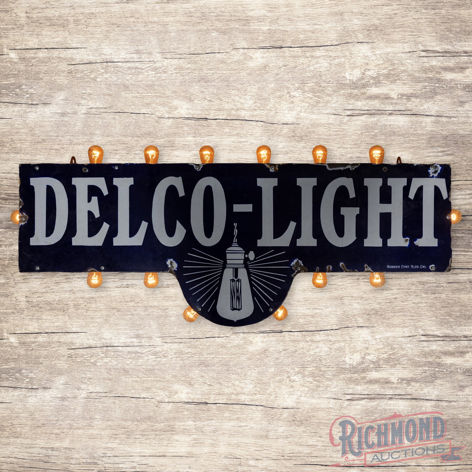 Delco Light 4' Die Cut Single Sided Porcelain Sign w/ Lighted Bulbs: SSP (single sided porcelain) die cut sign with an added can and bulbed perimeter has very good color and gloss. The sign features a large light bulb graphic in the lower with heavily shelved classic c