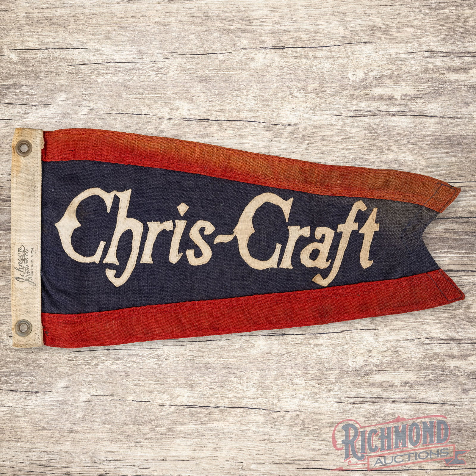 Chris Craft Boats Advertising Pennant Flag: Single sided die cut canvas advertising pennant has good color. The pennant features stitched "Chris-Craft" lettering which has minor toning. The perimeter has slight fading in the red with small non-