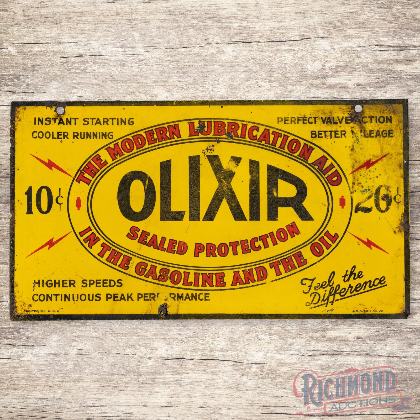Olixir The Modern Lubrication Aid in Gasoline and Oil Double Sided Tin Sign: DST (double sided tin) sign has good color and shine. The display has wear with fine scratches, discoloration, paint chips and faint bends. The perimeter has edge wear with minor loss. The reverse is 