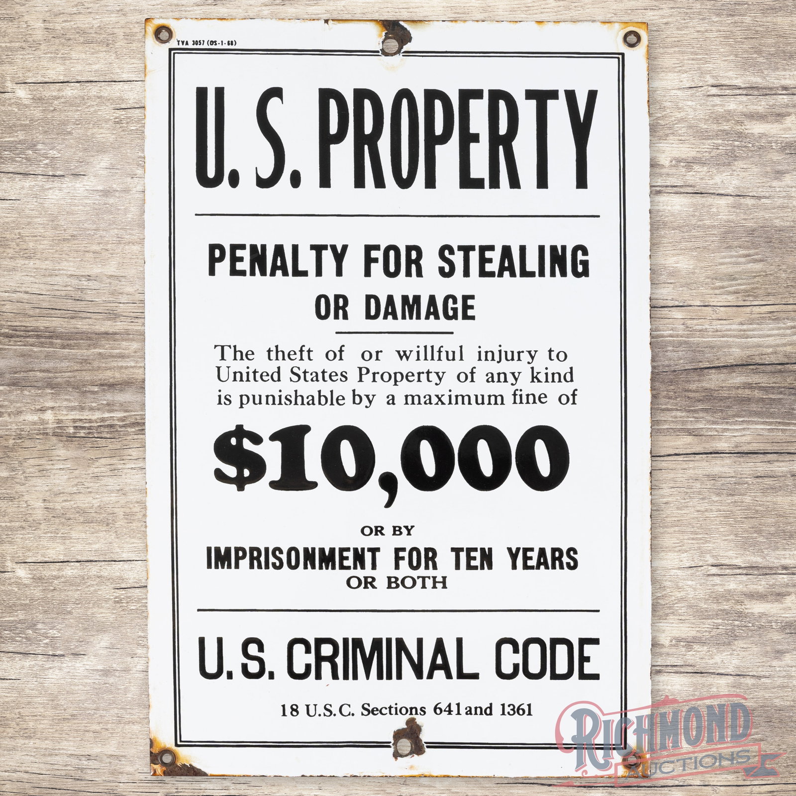 U.S. Property Penalty for Stealing Criminal Code TVA Single Sided Porcelain Sign: SSP (single sided porcelain) sign has very good color and gloss. The field is clean. The perimeter has an added mounting hole at the top and bottom edges with chips and discoloration along the edges. 