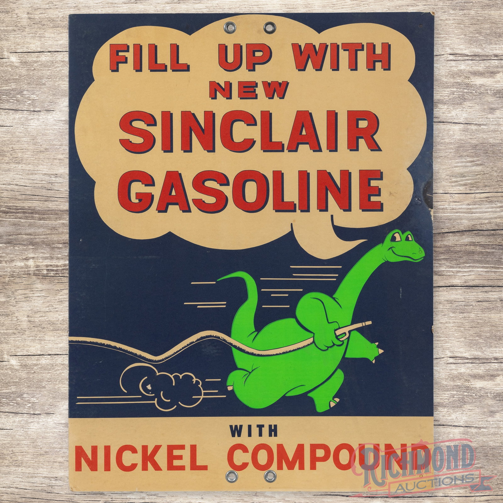 Fill Up With New Sinclair Gasoline DS Sign w/ Dino: Double sided cardboard sign has very good color. The display has toning with minor surface imperfections. The perimeter has light wear, minor bends and discoloration along the right hand side. The rev