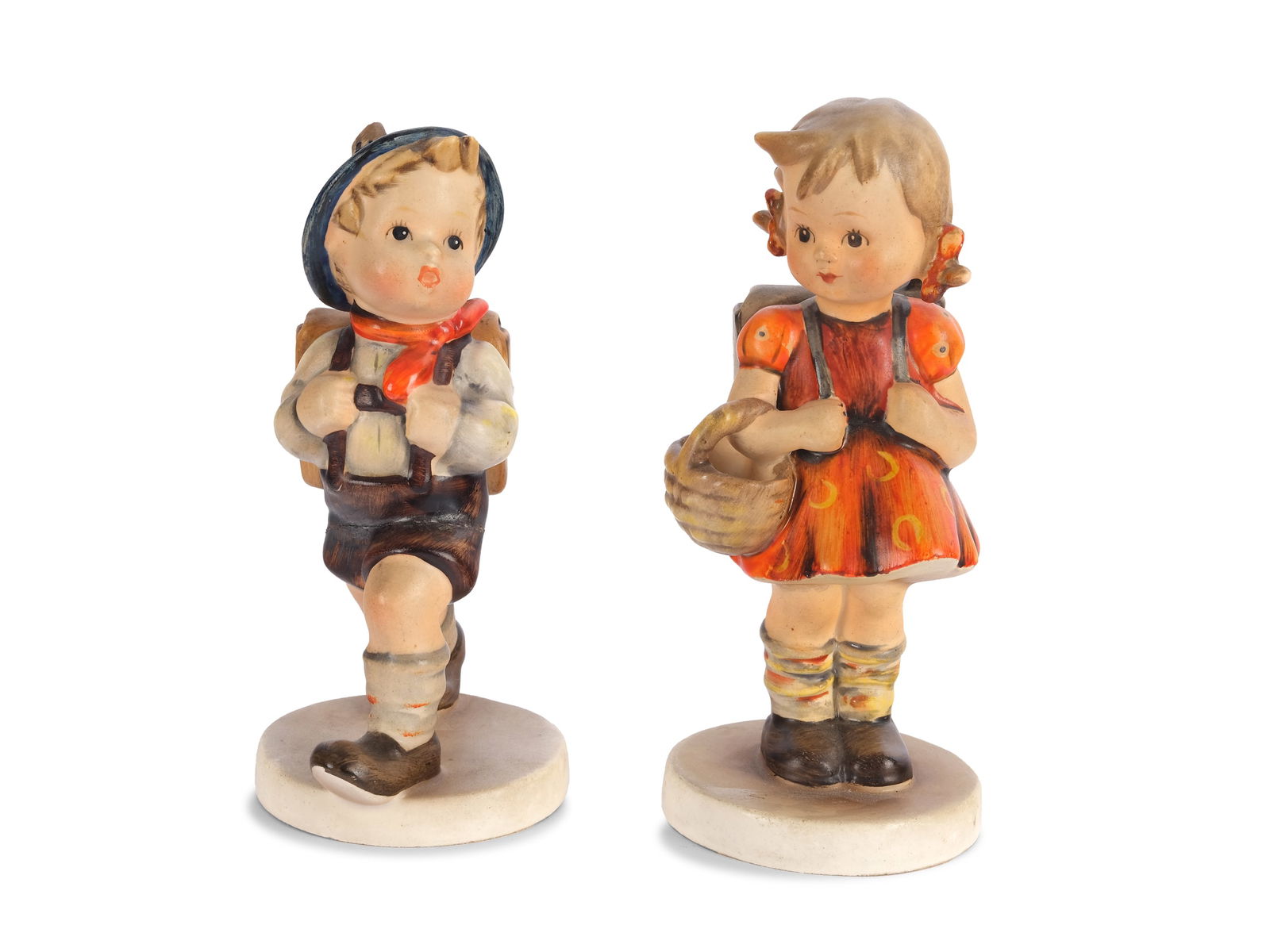 DESIGNED BY GOEBEL, SCHOOLGIRL AND SCHOOLBOY: Designed by Goebel Schoolgirl and schoolboyColorfully painted ceramicHeight 13 cm and 12.5 cmMarked on the bottomA break on the hat