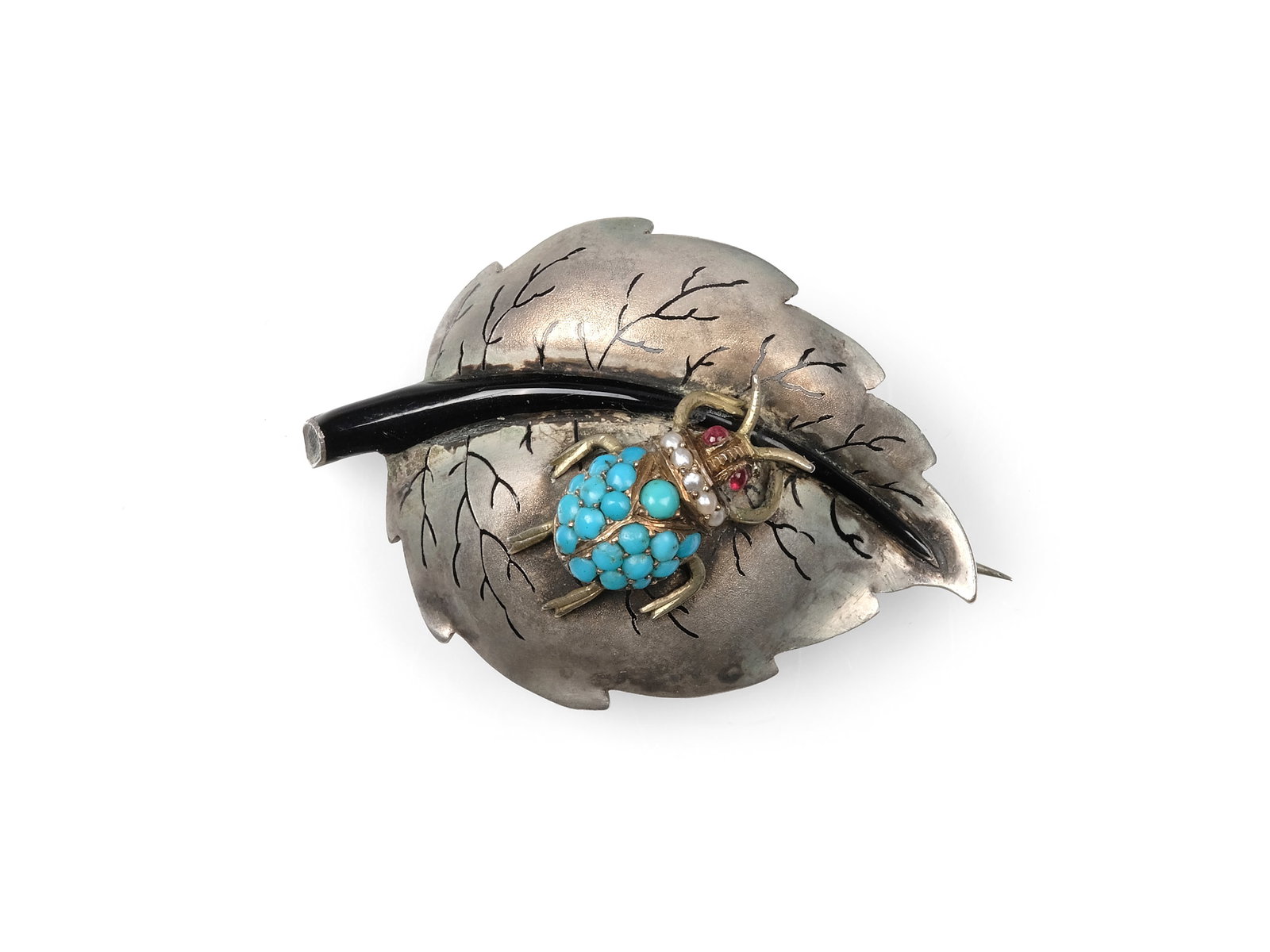 SILVER BROOCH IN THE SHAPE OF A LEAF, CIRCA 1900: Silver brooch in the shape of a leaf Circa 1900 Beetle set with turquoise, pearls, and rubies Length 4 cm Weight 8.1 g In original case Buyer's premium: 18%