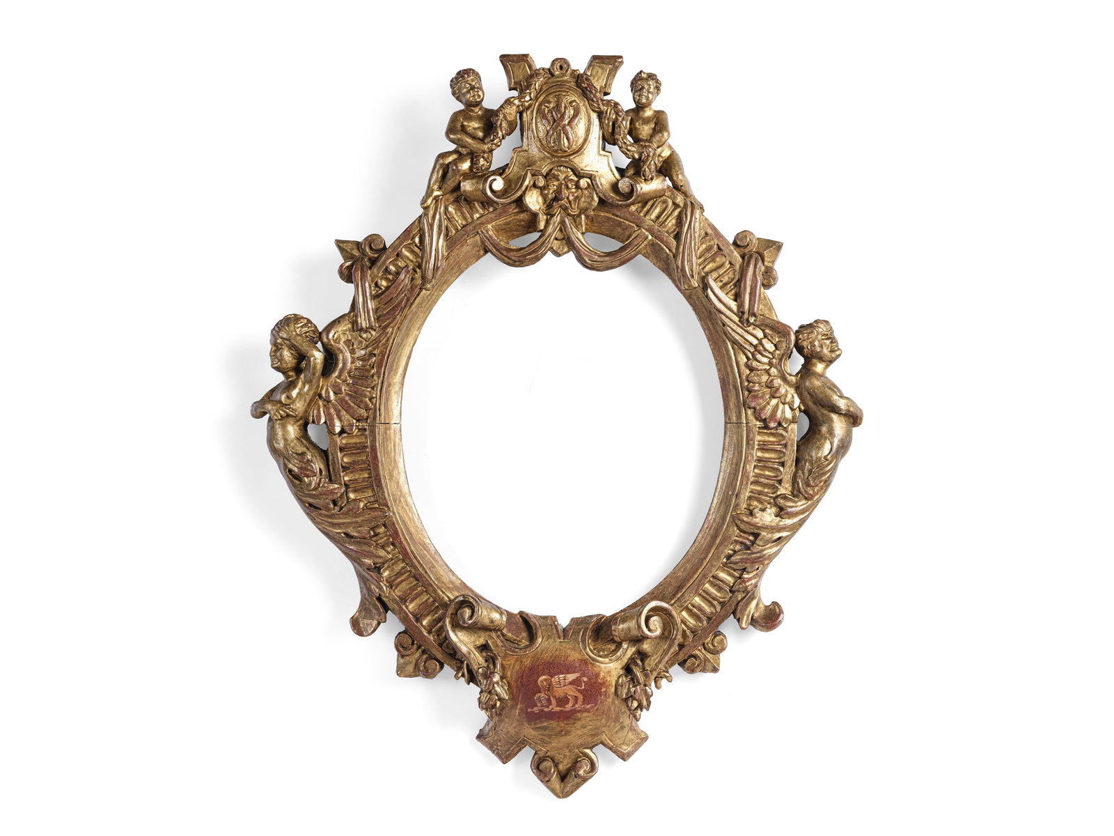 MAGNIFICENT OVAL FRAME,, CIRCA 1860: Magnificent oval frame, circa 1860With Venetian lionCarved and gilded woodHeight 81 cm, width 66 cm