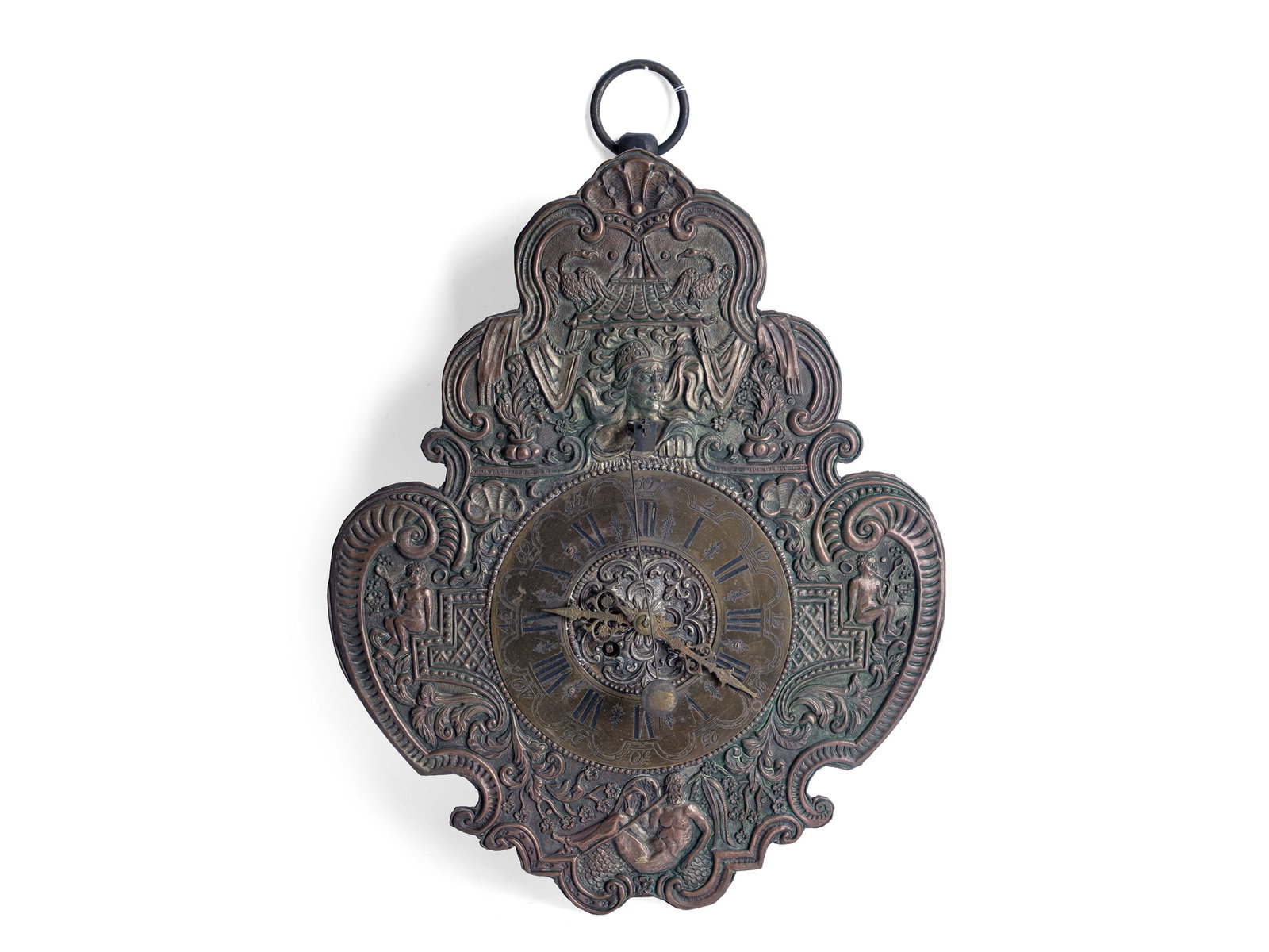 WALL CLOCK, 18TH CENTURY: Wall clock18th centuryIron, copper relief, traces of silver platingInventory label from the Imperial and Royal Ministry of Justice on the backBrass movementFront chimeTotal length 45 cm, width 31 cm,