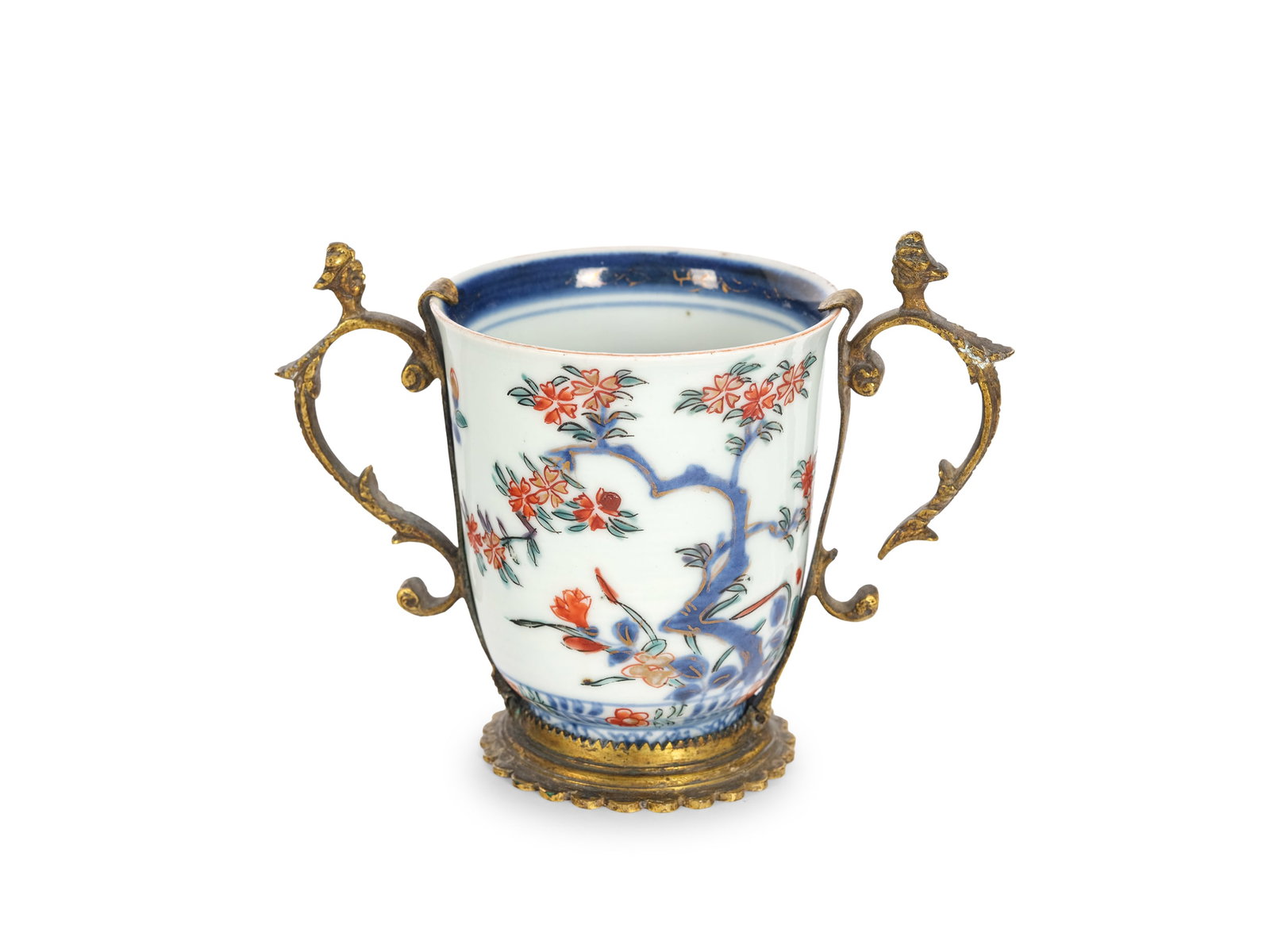 VIENNA PORCELAIN MANUFACTORY, ATTRIBUTED TO DU PAQUIER: Vienna Porcelain ManufactoryAttributed to Du PaquierChocolate cupFirst half of the 18th centuryWhite porcelain with Imari decorationMounted in fire-gilded bronzeHeight 9.5 cm, length 11 cmMinimal