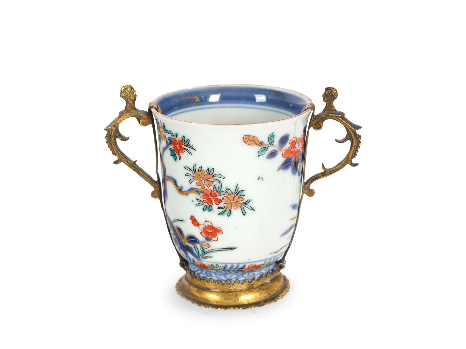VIENNA PORCELAIN MANUFACTORY, ATTRIBUTED TO DU PAQUIER: Vienna Porcelain ManufactoryAttributed to Du PaquierChocolate cupFirst half of the 18th centuryWhite porcelain with Imari decorationMounted in fire-gilded bronzeHeight 9.5 cm, length 13 cm