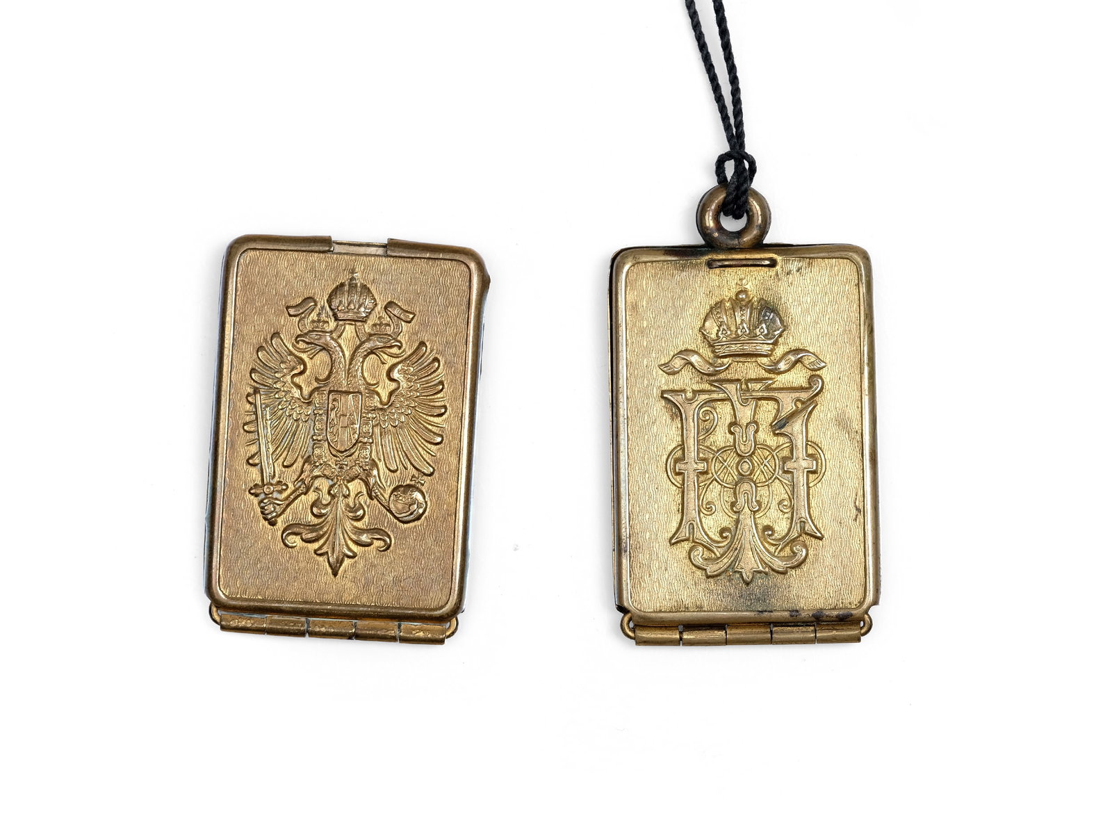 BUNDLE OF 2 IDENTIFICATION TAGS FOR OFFICERS, EMPEROR FRANZ JOSEF I: Bundle of 2 identification tags for officersEmperor Franz Josef IBrass with traces of gold platingPaper insert with name and unit designation Length 5 cm