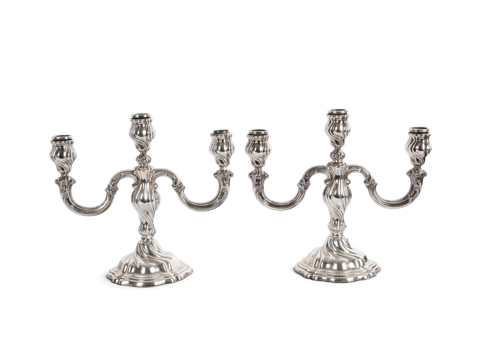PAIR OF CANDLESTICKS, THREE-ARMED: Pair of candlesticksThree-armedHallmarked silverHeight 23 cm each, width 27 cm eachTotal weight 1300 g including weighted base