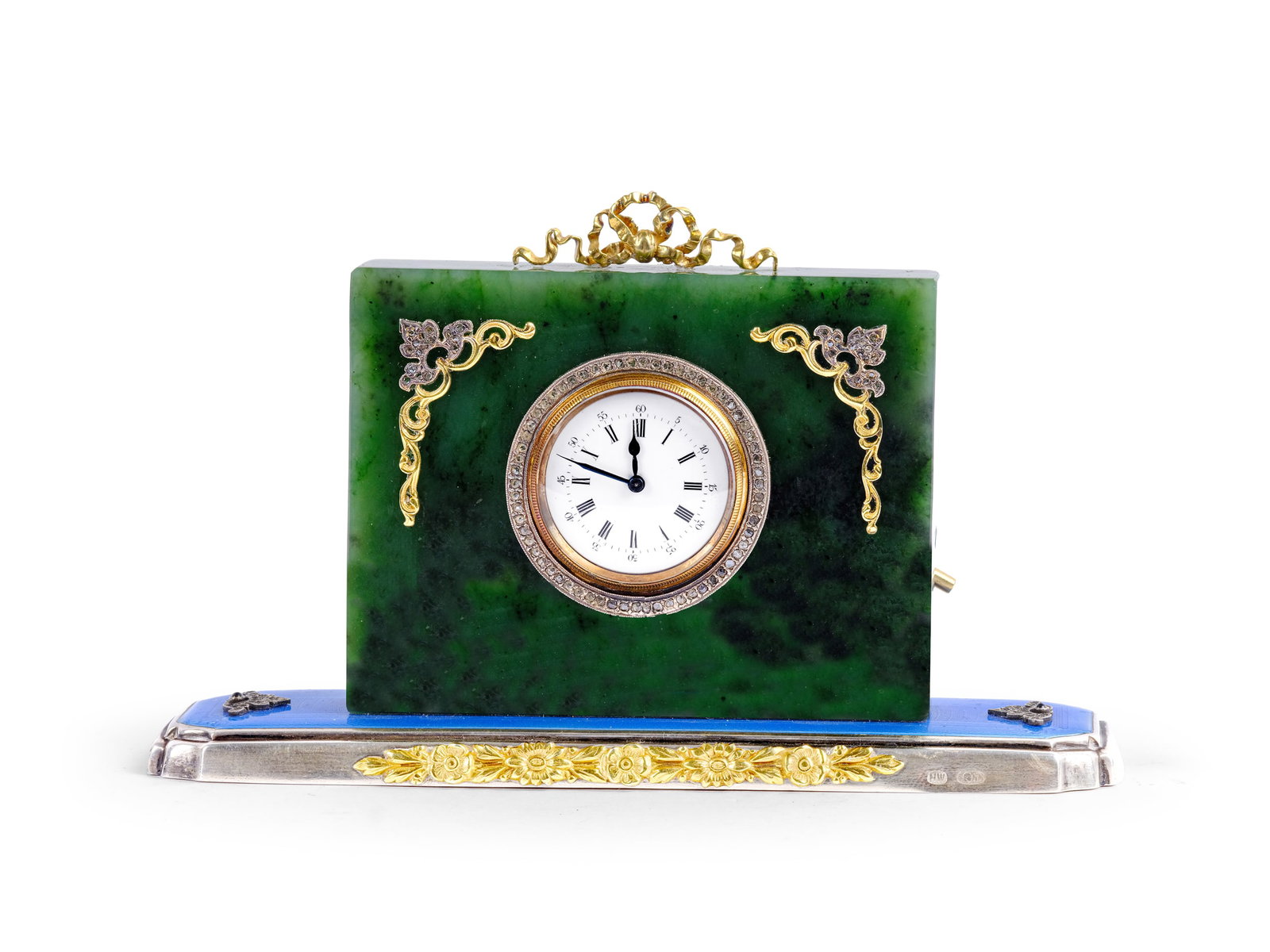 TABLE CLOCK IN THE STYLE OF CARL FABERGE, CASE MADE OF JADE/NEPHRITE: Table clock in the style of Carl FabergeCase made of jade/nephriteCentral movement Gilt silver appliques set with diamonds Gilt bezel set in a silver ring with a diamond rose Base in silver and Gilt s