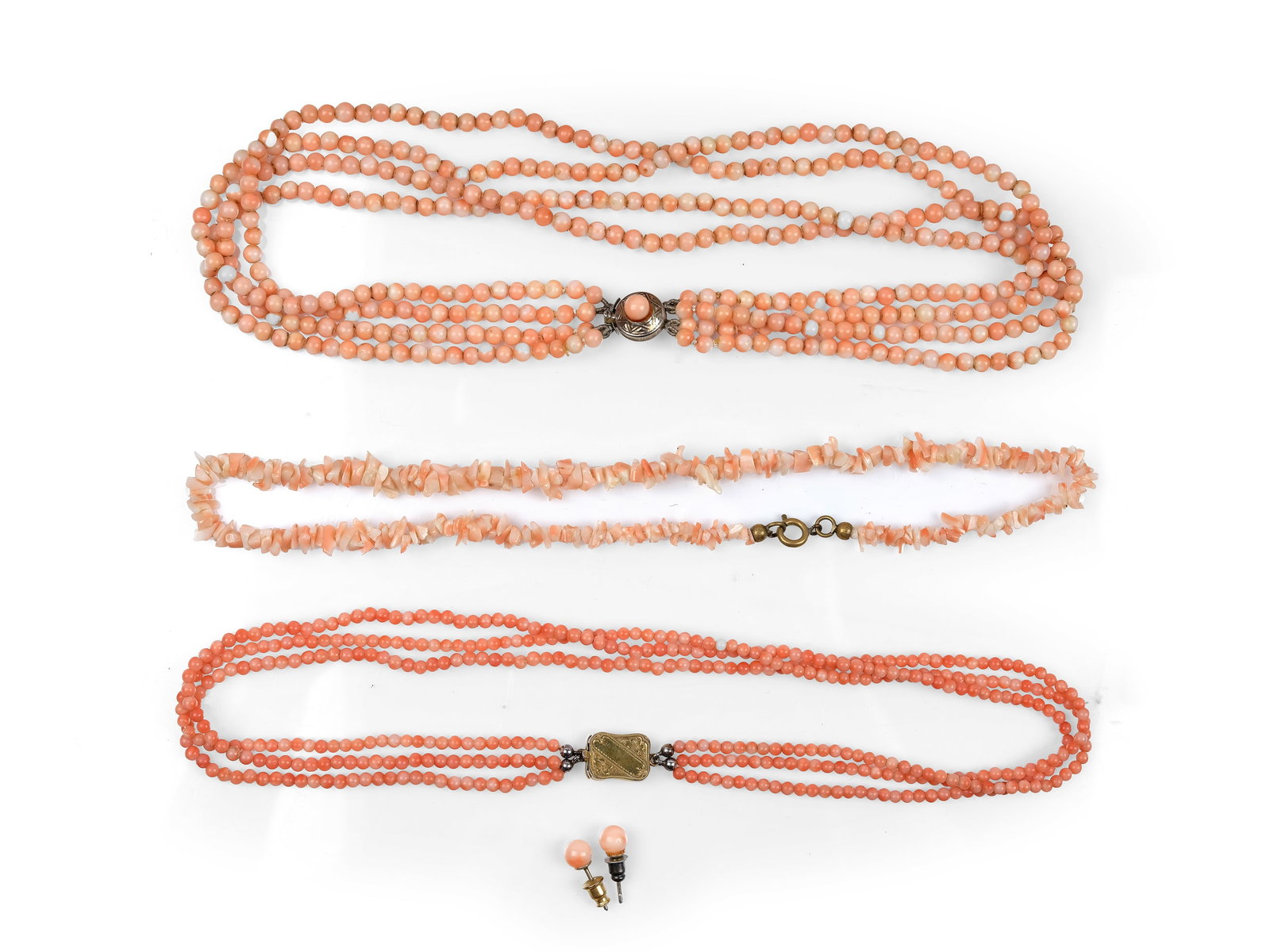 BUNDLE OF CORAL: 3 NECKLACES and PAIR OF STUD EARRINGS, ANGEL SKIN CORAL: Bundle of Coral: 3 Necklaces and Pair of Stud EarringsAngel Skin CoralClasps made of brass, silver, and gilt metalLength 41 to 41 cmTotal weight 68.4 g