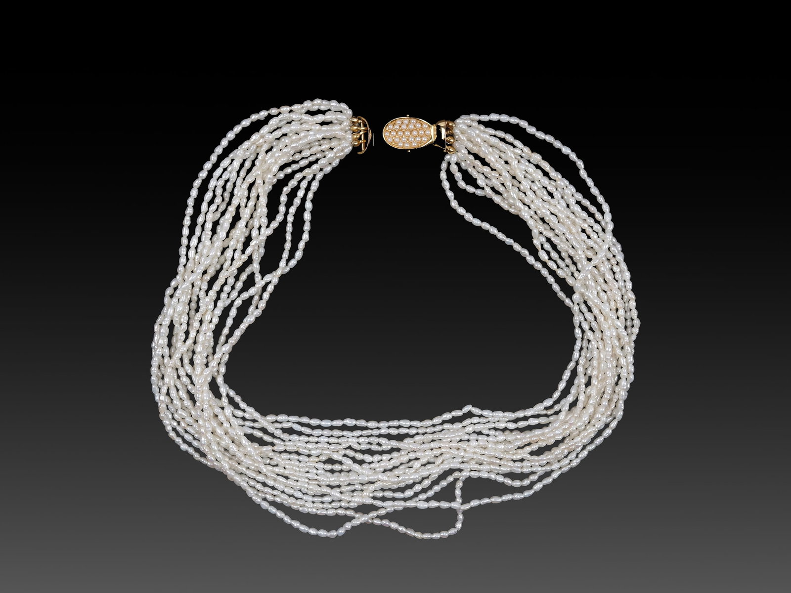 16-STRAND FRESHWATER PEARL NECKLACE, GILT SILVER CLASP: 16-strand freshwater pearl necklace, gilt silver claspLength 47 cmWeight 78.4 g