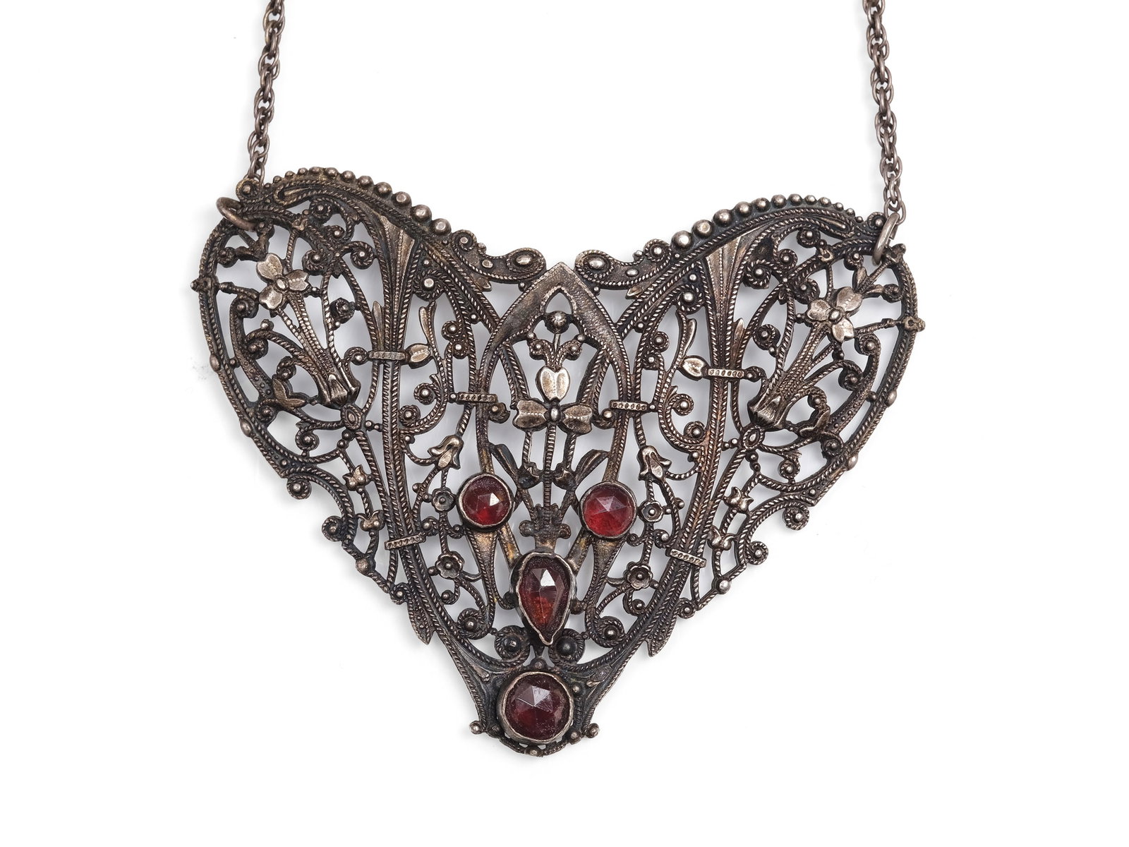 NECKLACE, HALLMARKED SILVER: NecklaceHallmarked silverWith garnetsCirca 1920Pendant length 6.5 cm, height 5.5 cmWeight 20.5 g