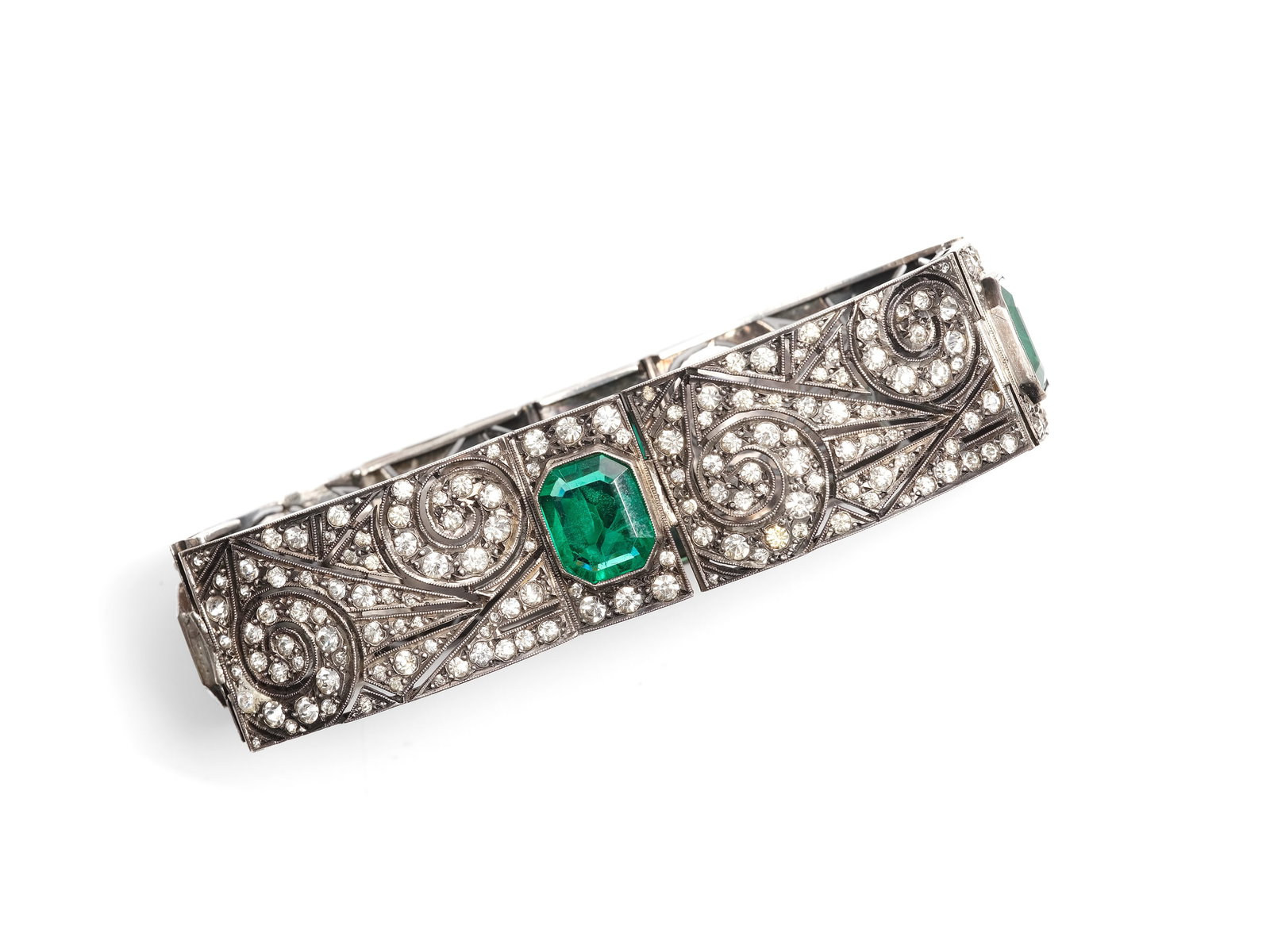 BRACELET, ART DECO TRAVEL JEWELRY: BraceletArt Deco travel jewelrywith emeralds, imitation stonescolorless gemstones with diamond-cut foilLength 17.5 cm, width 3 cmWeight 48.5 g