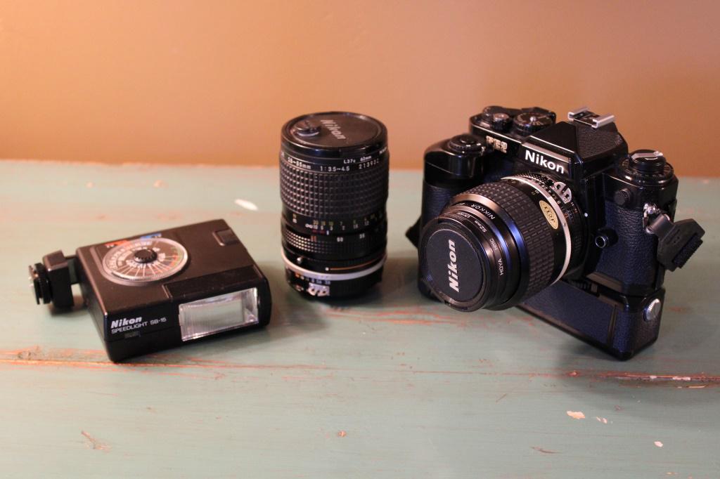 Nikon MD-12 FE2 Camera: Nikon MD-12 FE2 Camera with case Nikkor 35 mm lense Nikkor 28-85 mm lense Nikon Speed Light SB-15