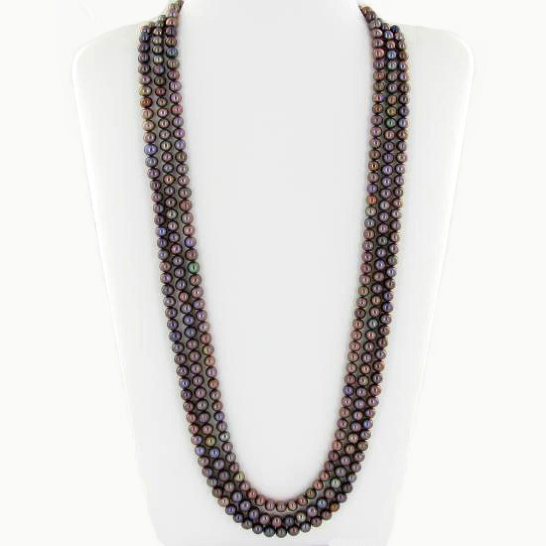 Black Saltwater Pearl Three Strand Necklace: Excellent black saltwater pearls; uniformly sized (6.5mm); 330 count; 75" (25" 3 strands);