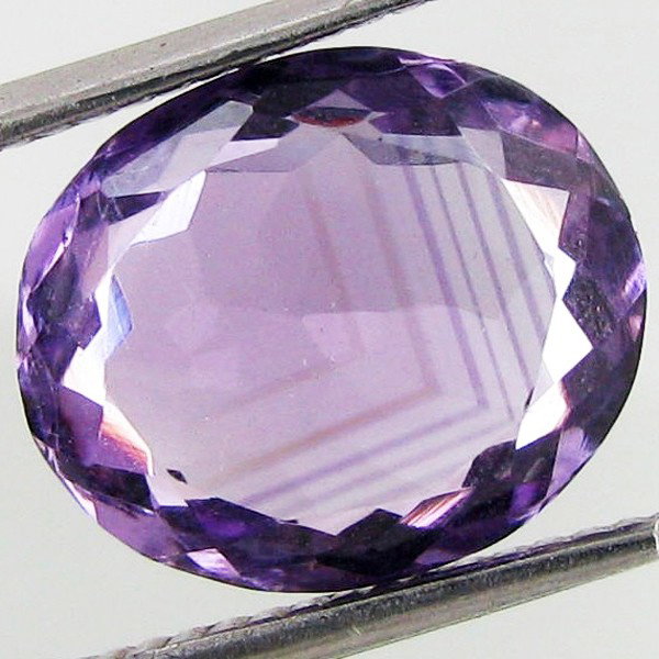 3.9ct Purple Amethyst Oval: Excellent piece; well cut and colored; with treatment