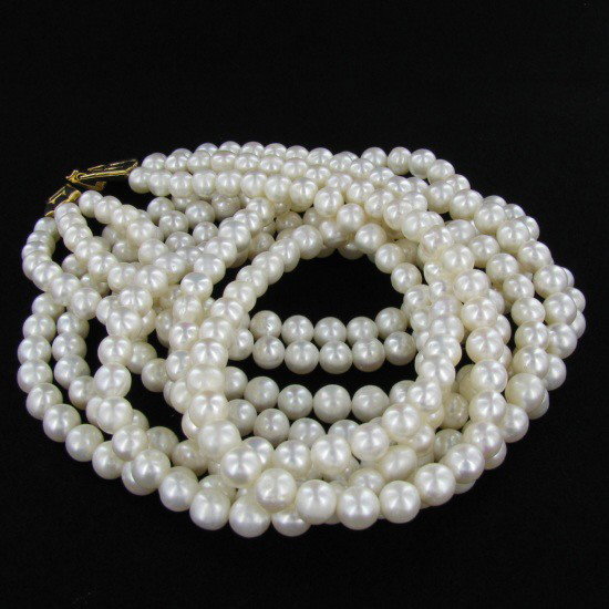 White Saltwater Pearl Three Strand Necklace: Excellent white saltwater pearls; uniformly sized (6.5mm); 330 count; 75" (25" 3 strands);