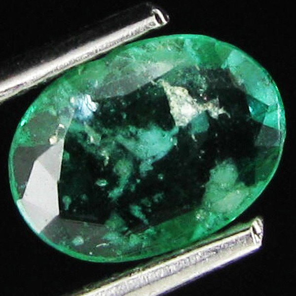 .97ct Oval Deep Green Colombian Emerald Colombia: Excellent piece; Well cut and colored; with treatment