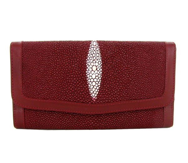 Ladies Stingray Hide Clutch Purse Wallet: Well made; brand new ladies Stingray Hide burgundy clutch purse/wallet. 7.5" x 4" x 1" when folded. Multiple inside sections; one zippered with multiple dividers and a smaller zippered section inside