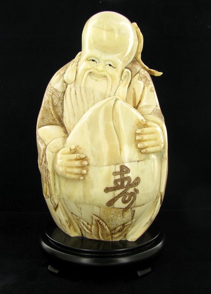 Chinese Handcarved Bone Wiseman With Lotus Bud: Excellent handcarved piece; 9"