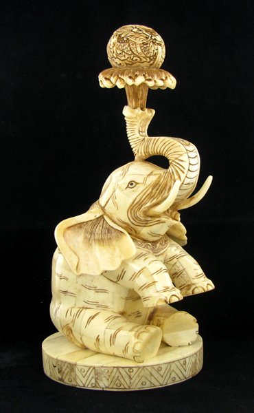 Chinese Handcarved Bone Elephant Holding Dragon Ball: Excellent handcarved piece; 11"