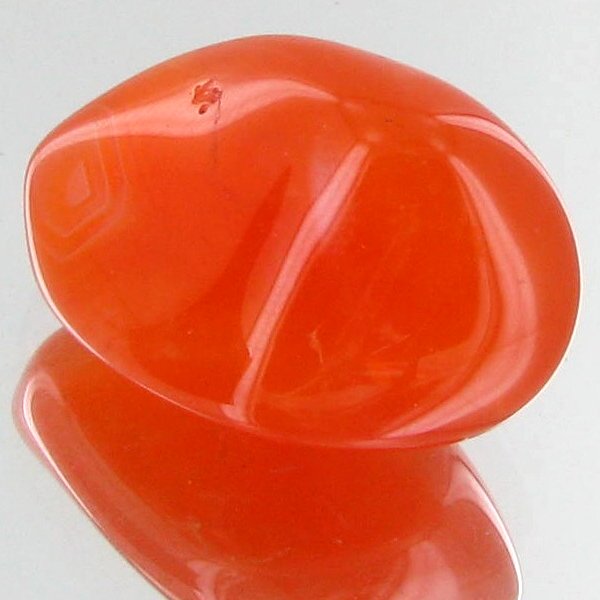 30.35ct Carnelian Freeform Cabochon: Excellent and well colored; with treatment