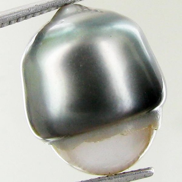 19.4ct Freeform Tahitian Black Pearl: Scarcely shaped; drilled and ready for one-of-a-kind pendant