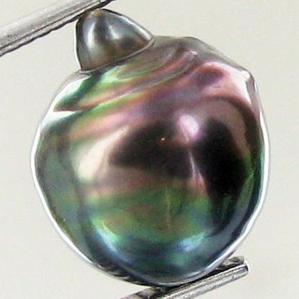 9.9ct Freeform Tahitian Black Pearl: Scarcely shaped; drilled and ready for one-of-a-kind pendant