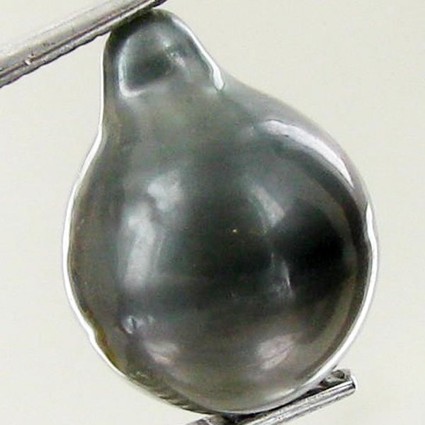 13.8ct Freeform Tahitian Black Pearl: Scarcely shaped; drilled and ready for one-of-a-kind pendant