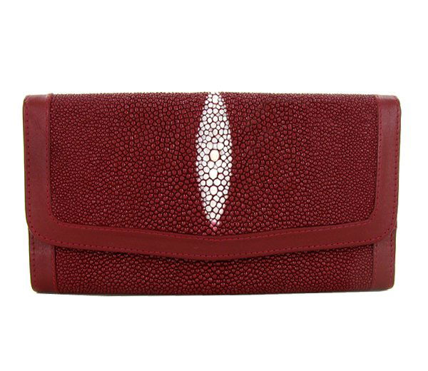 Ladies Stingray Hide Clutch Purse Wallet: Well made; brand new ladies Stingray Hide burgundy clutch purse/wallet. 7.5" x 4" x 1" when folded. Multiple inside sections; one zippered with multiple dividers and a smaller zippered section inside