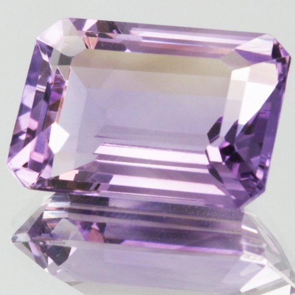 10.8ct Strong Purple Purple Amethyst Emerald Cut: Excellent heated grade 9 of 10 specimen; estimated Gem Guide wholesale $540, estimated retail $1620; Uruguay origin