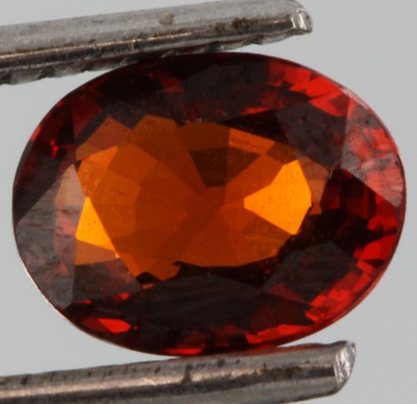 1.5ct Amber Red Spessartite Garnet Oval Cut Cut: Excellent unheated grade 8 of 10 specimen; estimated Gem Guide wholesale $40, estimated retail $120; Tanzania origin