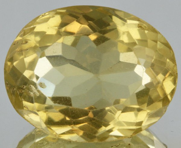 27ct Lemon Yellow Citrine Oval Cut: Excellent heated grade 9 of 10 specimen; estimated Gem Guide wholesale $35, estimated retail $100; Africa origin
