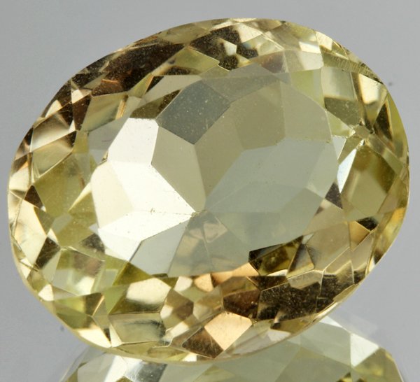 38.85ct Lemon Yellow Citrine Oval Cut: Excellent heated grade 9 of 10 specimen; estimated Gem Guide wholesale $35, estimated retail $100; Brazil origin