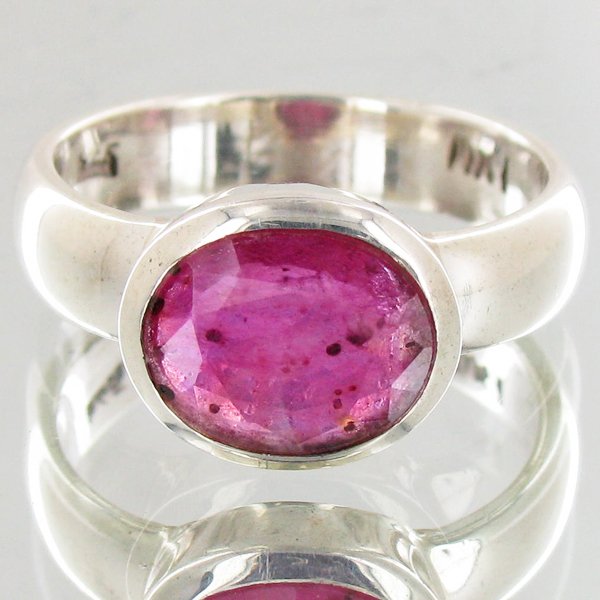 32.4twc Ruby Sterling Ring: Well crafted piece; stone with customary treatment