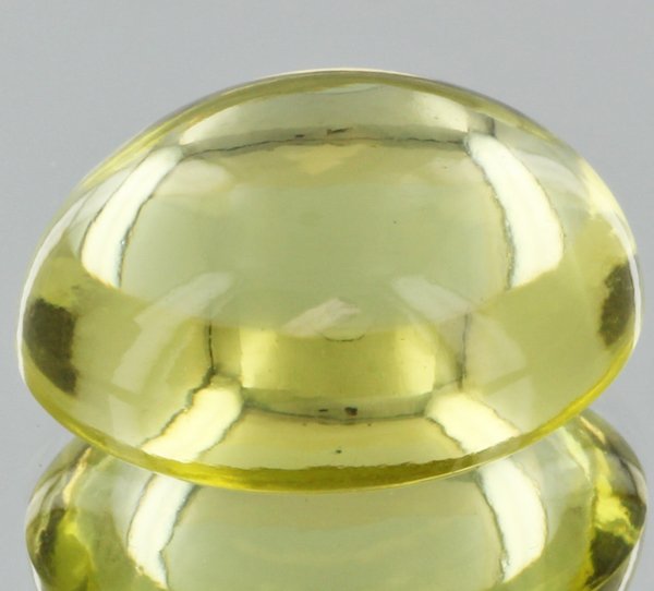 20.6ct Lemon Yellow Citrine Cabochon Cut: Excellent heated grade 9 of 10 specimen; estimated Gem Guide wholesale $35, estimated retail $100; Brazil origin