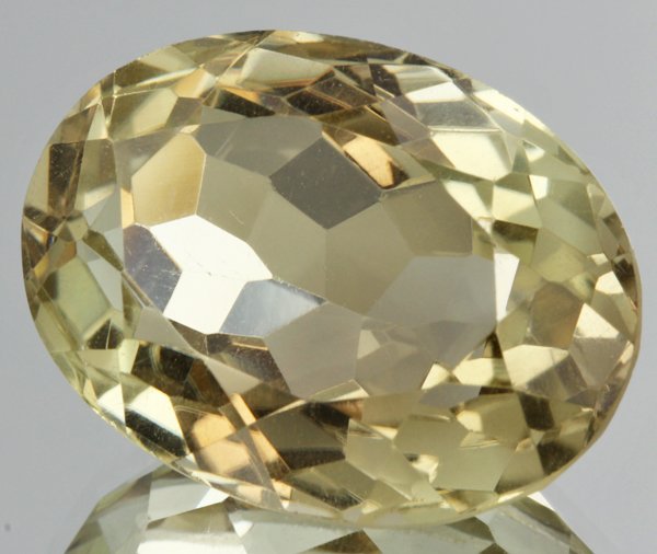 38.4ct Lemon Yellow Citrine Oval Cut: Excellent heated grade 9 of 10 specimen; estimated Gem Guide wholesale $35, estimated retail $100; Brazil origin