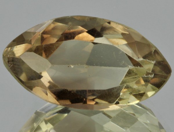 10.7ct Lemon Yellow Citrine Marquise Cut: Excellent heated grade 9 of 10 specimen; estimated Gem Guide wholesale $35, estimated retail $100; Brazil origin