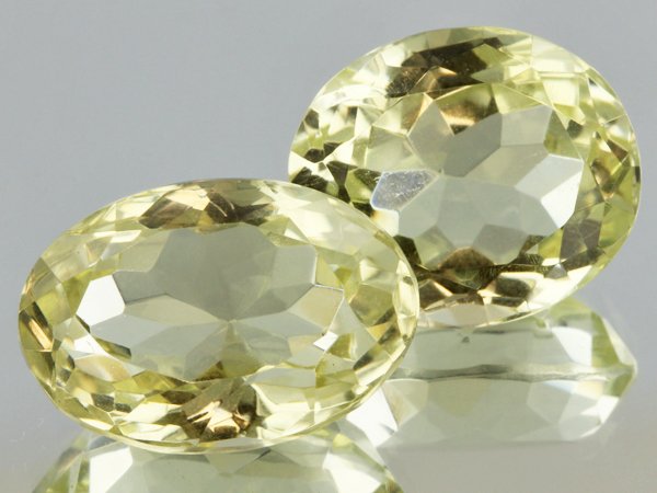 30.3ct Lemon Yellow Citrine Oval Cut Pair: Excellent heated grade 9 of 10 specimen; estimated Gem Guide wholesale $35, estimated retail $100; Africa origin