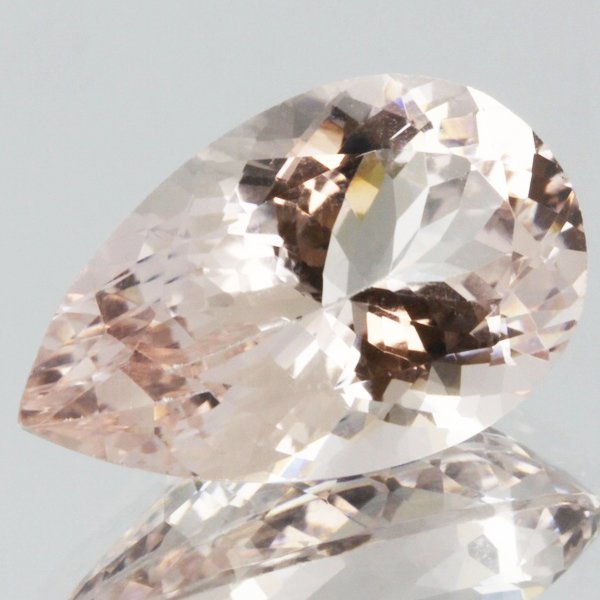 7.3ct Strong Peach Morganite Pear Cut: Excellent heated grade 8 of 10 specimen; estimated Gem Guide wholesale $1241, estimated retail $4380; Brazil origin