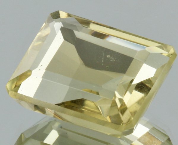 17.7ct Lemon Yellow Citrine Emerald Cut: Excellent heated grade 9 of 10 specimen; estimated Gem Guide wholesale $35, estimated retail $100; Brazil origin