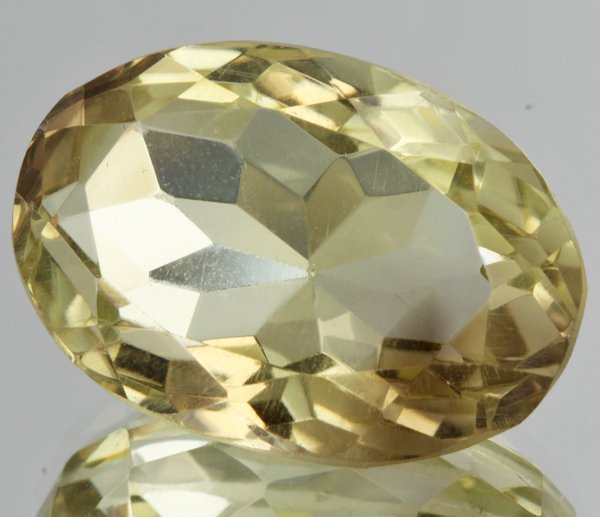 30.85ct Lemon Yellow Citrine Oval Cut: Excellent heated grade 9 of 10 specimen; estimated Gem Guide wholesale $35, estimated retail $100; Brazil origin