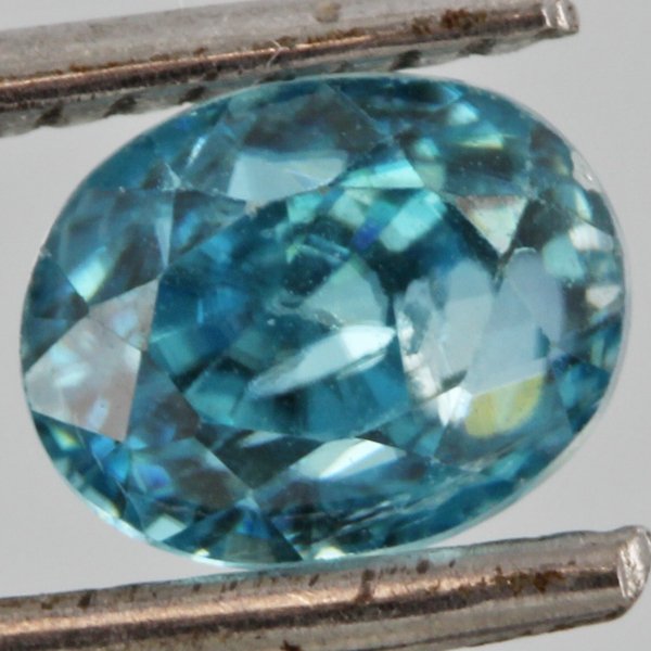 2.1ct Neon Blue Zircon Oval Cut Cut: Excellent heated grade 7 of 10 specimen; estimated Gem Guide wholesale $85, estimated retail $250; Cambodia origin