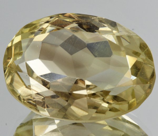 33.3ct Lemon Yellow Citrine Oval Cut: Excellent heated grade 9 of 10 specimen; estimated Gem Guide wholesale $35, estimated retail $100; Brazil origin