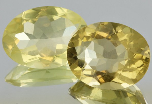 21.3ct Lemon Yellow Citrine Oval Cut Pair: Excellent heated grade 9 of 10 specimen; estimated Gem Guide wholesale $35, estimated retail $100; Africa origin