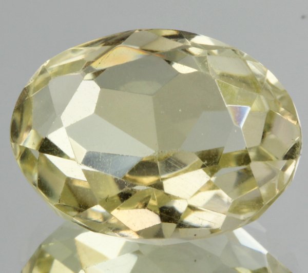 10.3ct Lemon Yellow Citrine Oval Cut: Excellent heated grade 9 of 10 specimen; estimated Gem Guide wholesale $35, estimated retail $100; Brazil origin